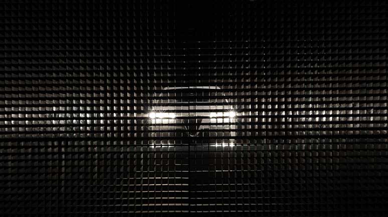 Photo of car with headlights on