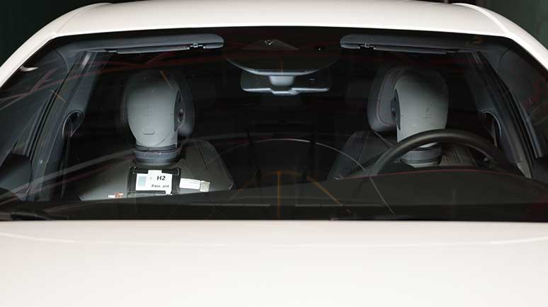 Photo of mannequins inside car