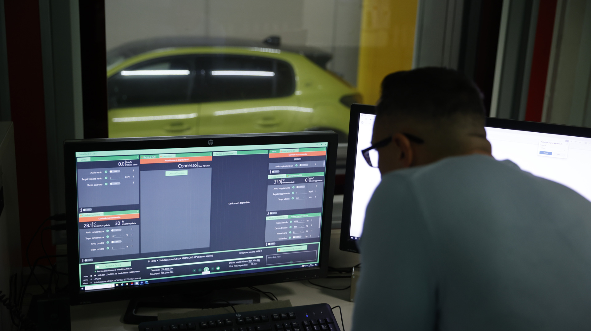 A man looking at a screen